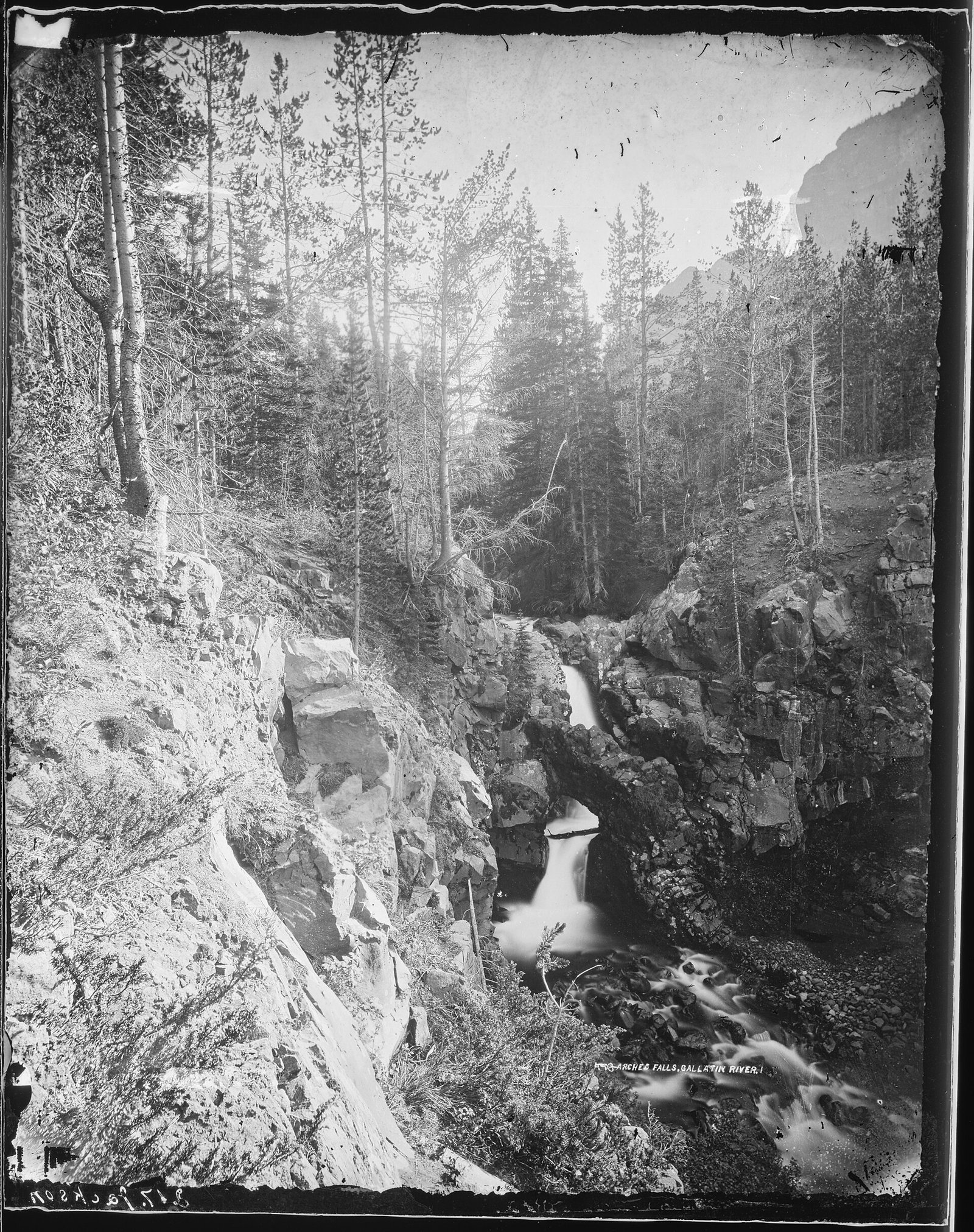 The Gallatin River running through mountain scenery