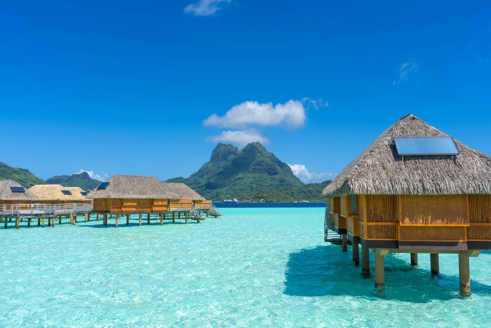 Overwater bungalows across Bora Bora’s clear blue lagoon