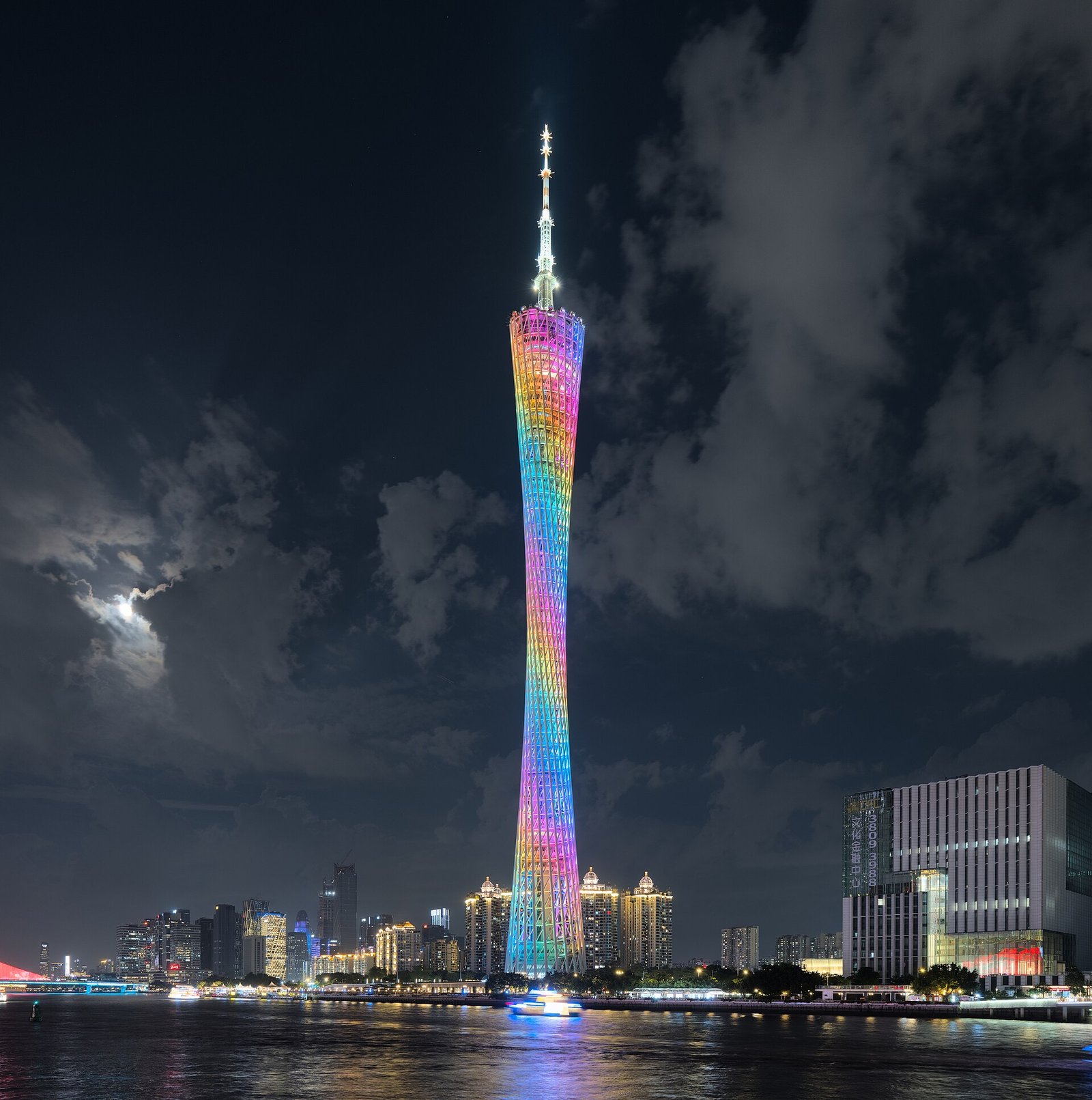 Canton Tower illuminated beside the Pearl River