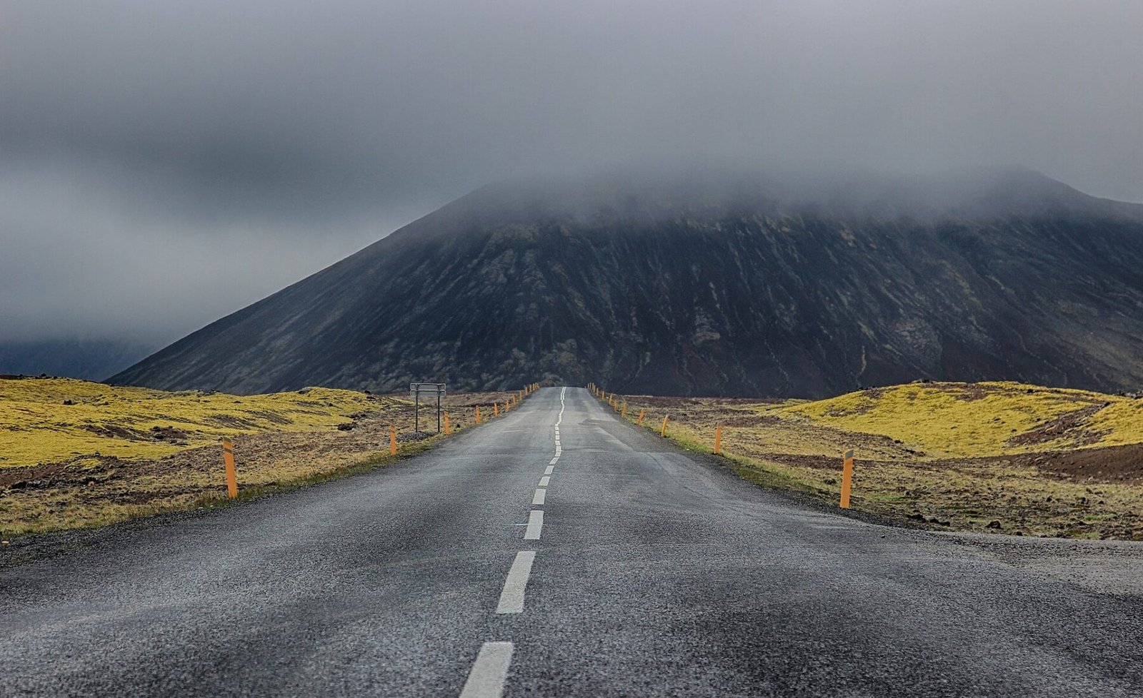 A mountain road crossing the dramatic Icelandic landscape