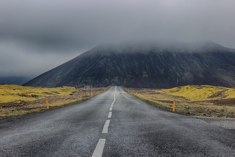 A mountain road crossing the dramatic Icelandic landscape