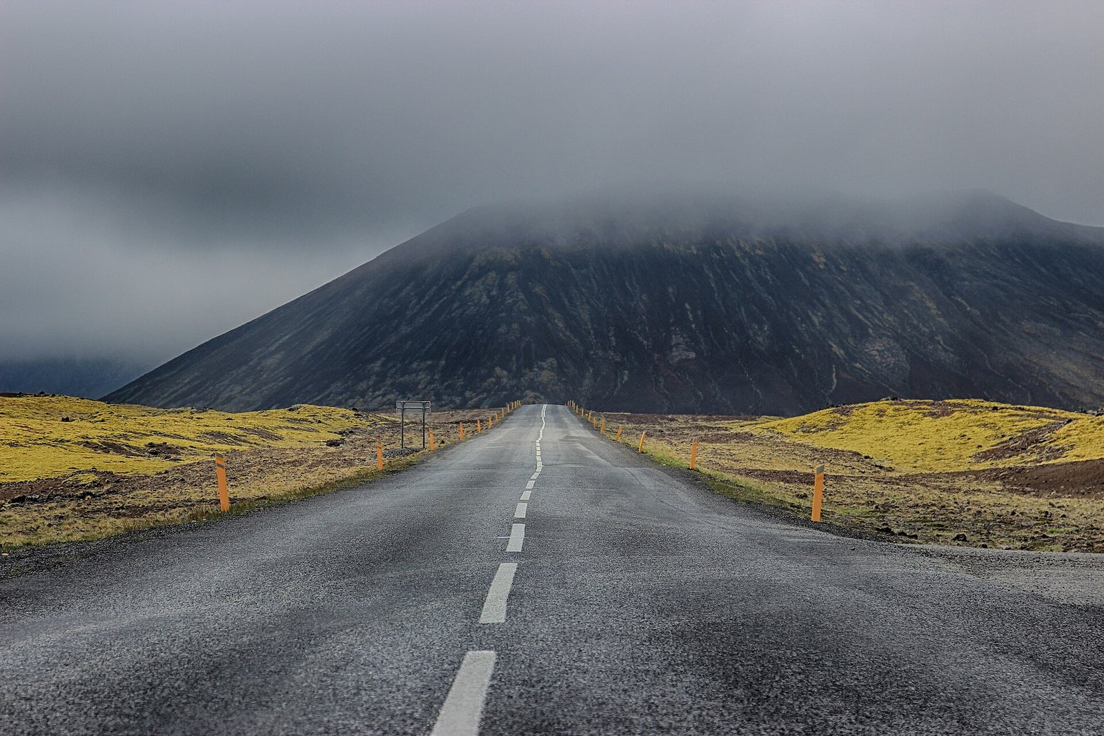 A mountain road crossing the dramatic Icelandic landscape