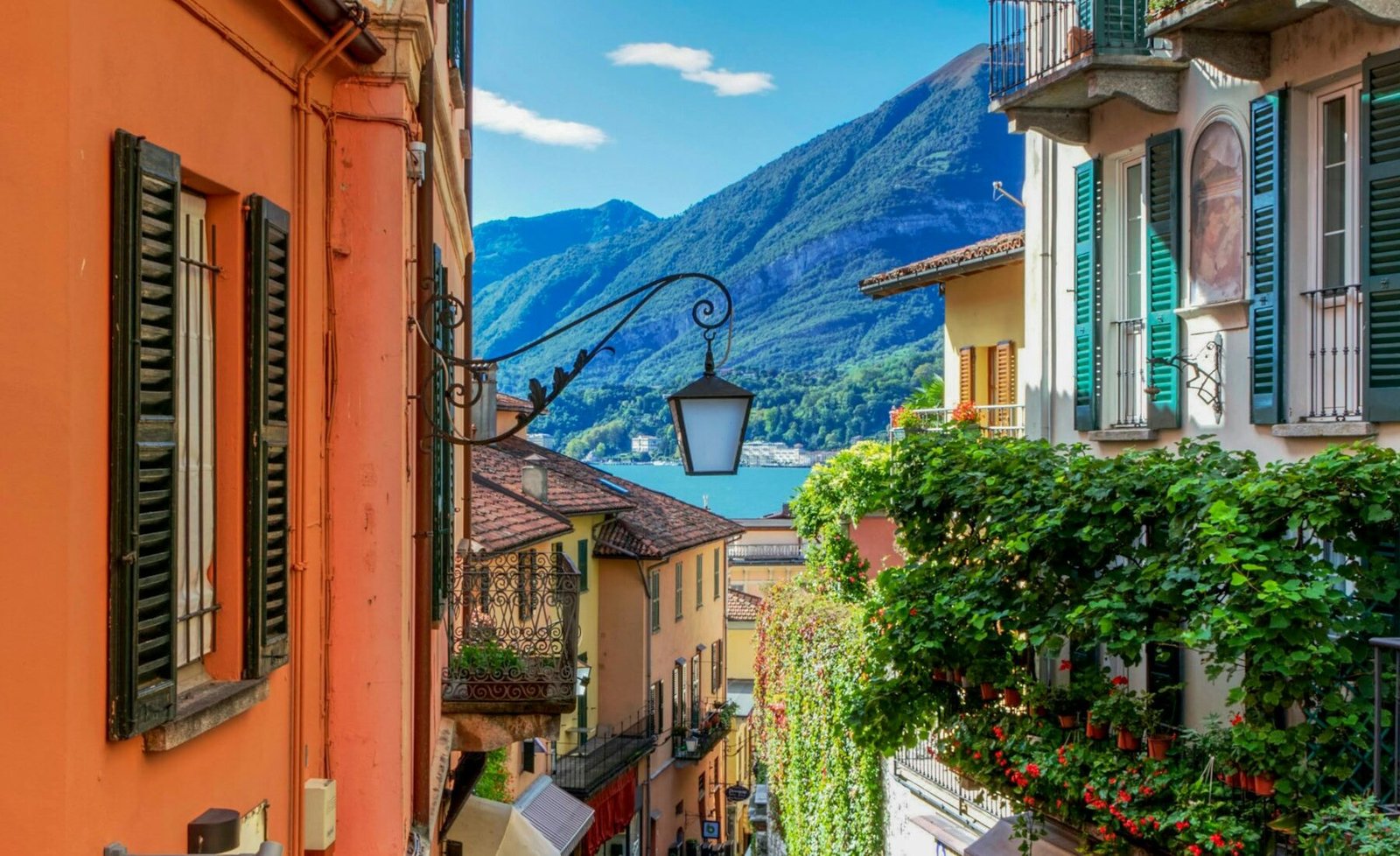 A cobblestone lane leading toward Lake Como in Bellagio