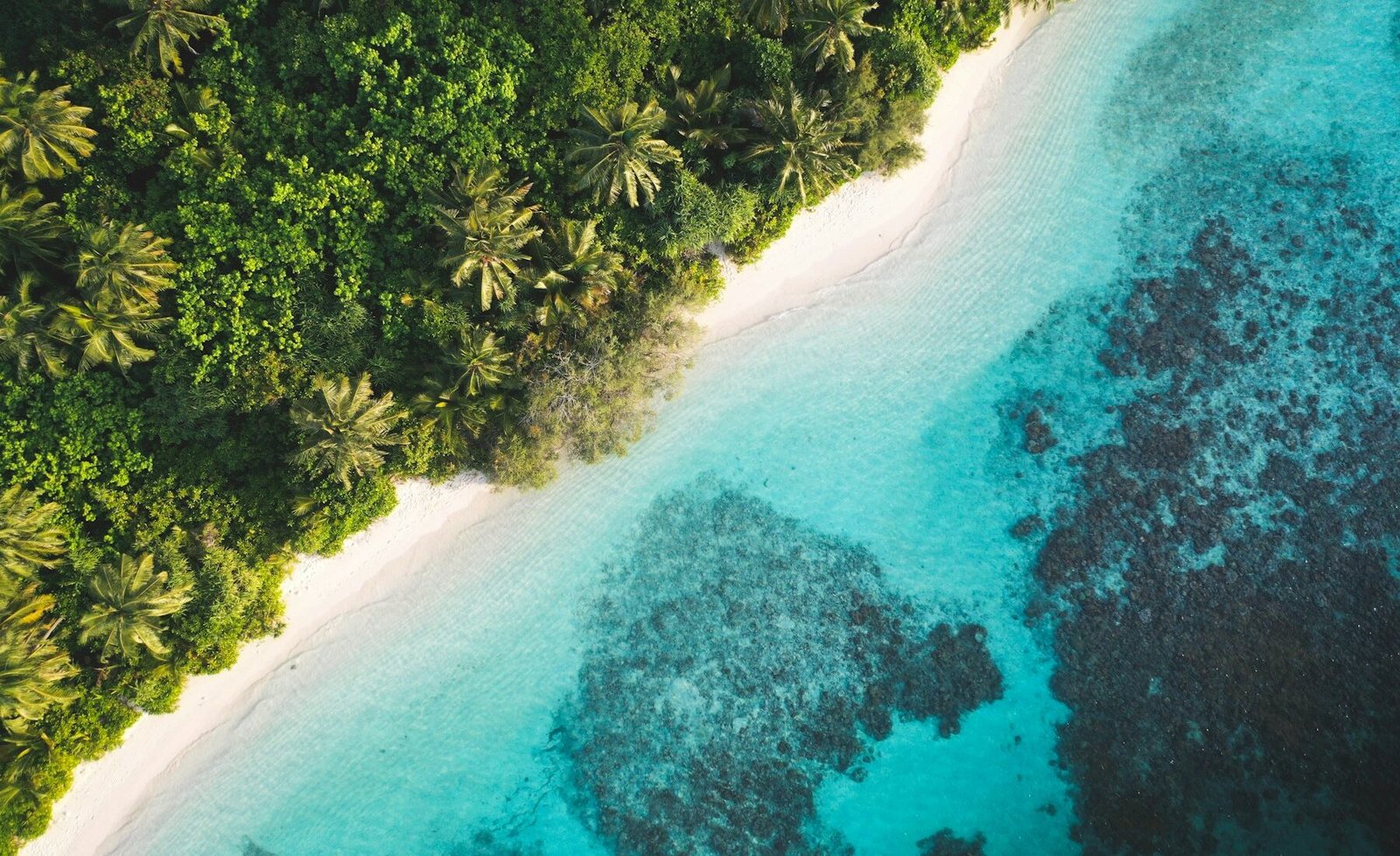 An overwater resort surrounded by turquoise water in the Maldives