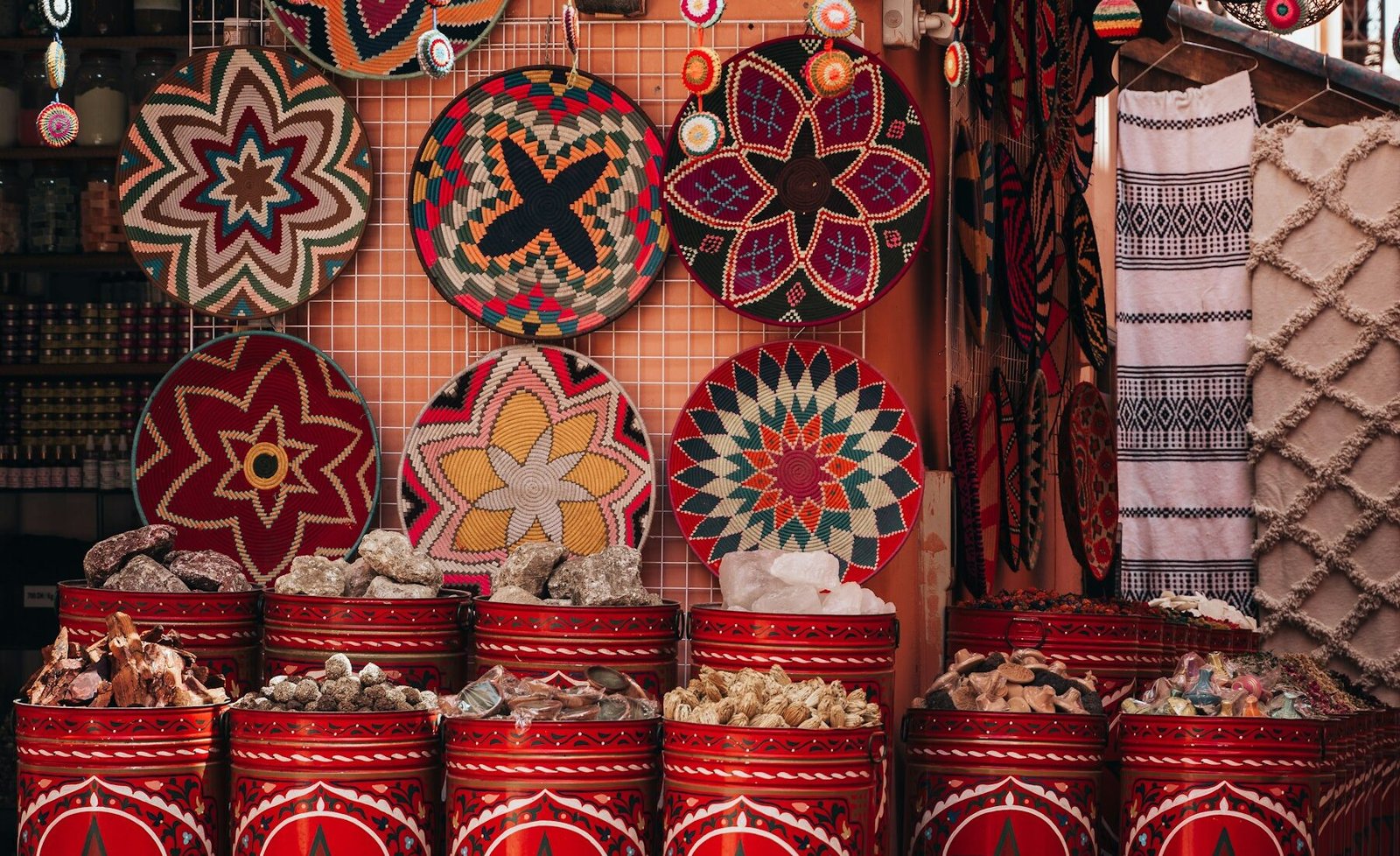 A colorful market stall filled with Moroccan spices and crafts