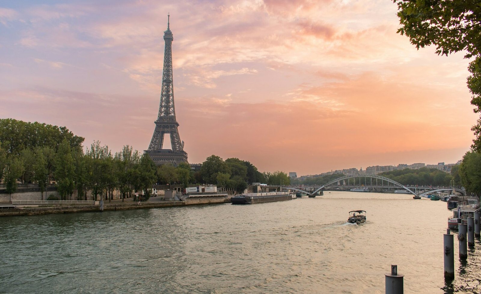 The Eiffel Tower rising above Paris at sunset