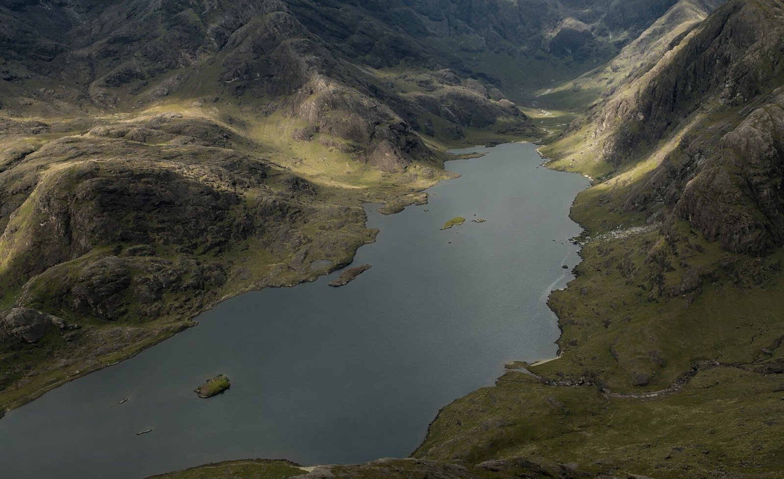 A quiet Highland loch surrounded by mountains