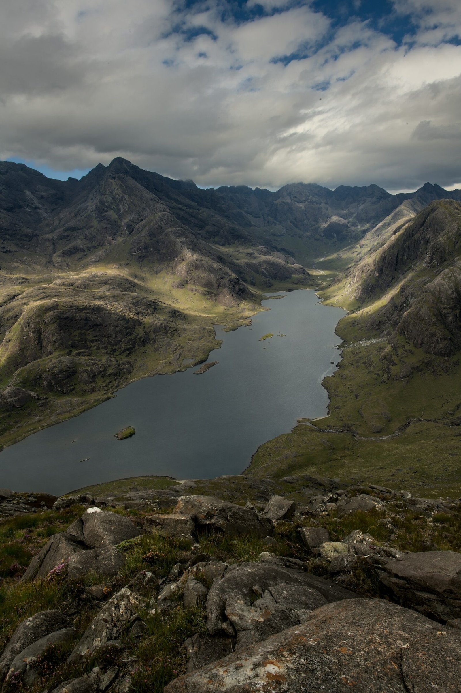 A quiet Highland loch surrounded by mountains