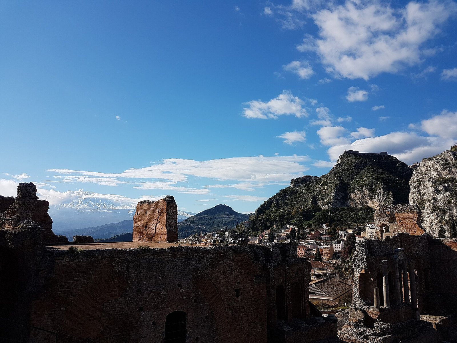 Taormina with Mount Etna in the distance