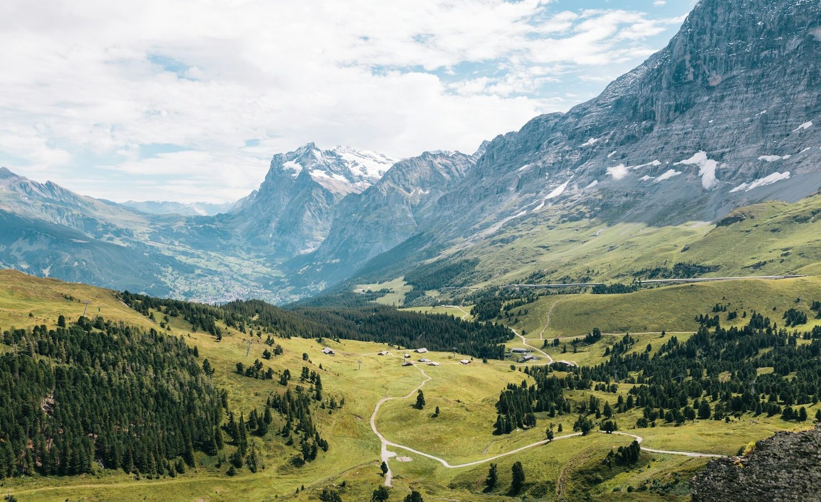The green Lauterbrunnen Valley beneath the Swiss Alps