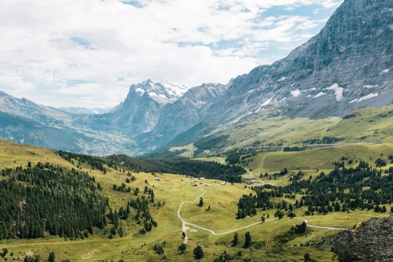 The green Lauterbrunnen Valley beneath the Swiss Alps