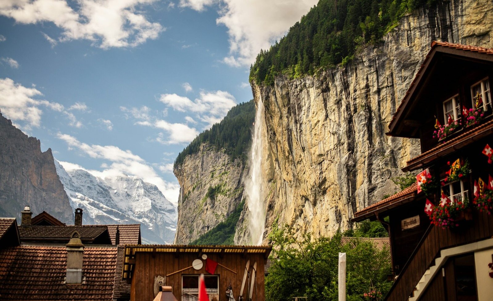 A waterfall descending behind Lauterbrunnen village
