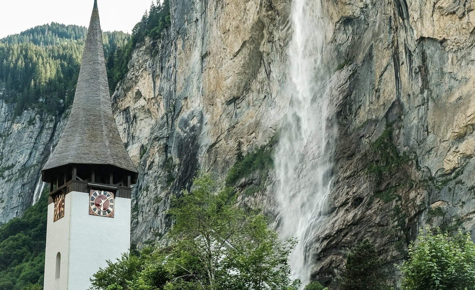 A church with Staubbach Falls in the background