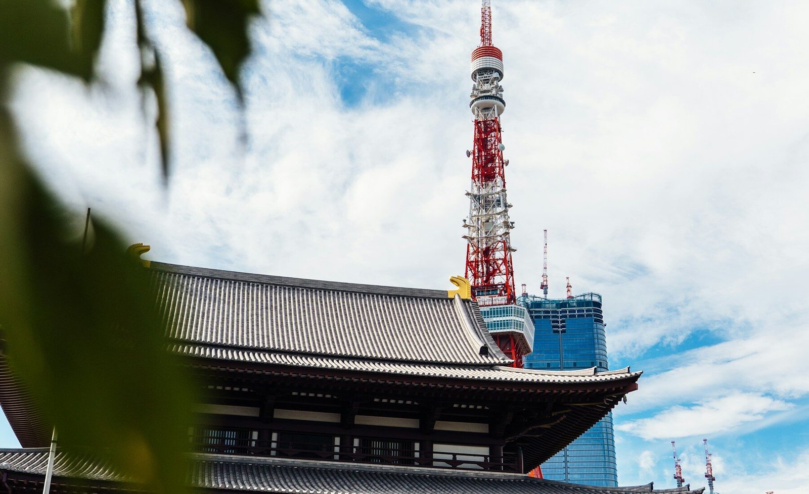 A traditional temple framed by Tokyo Tower