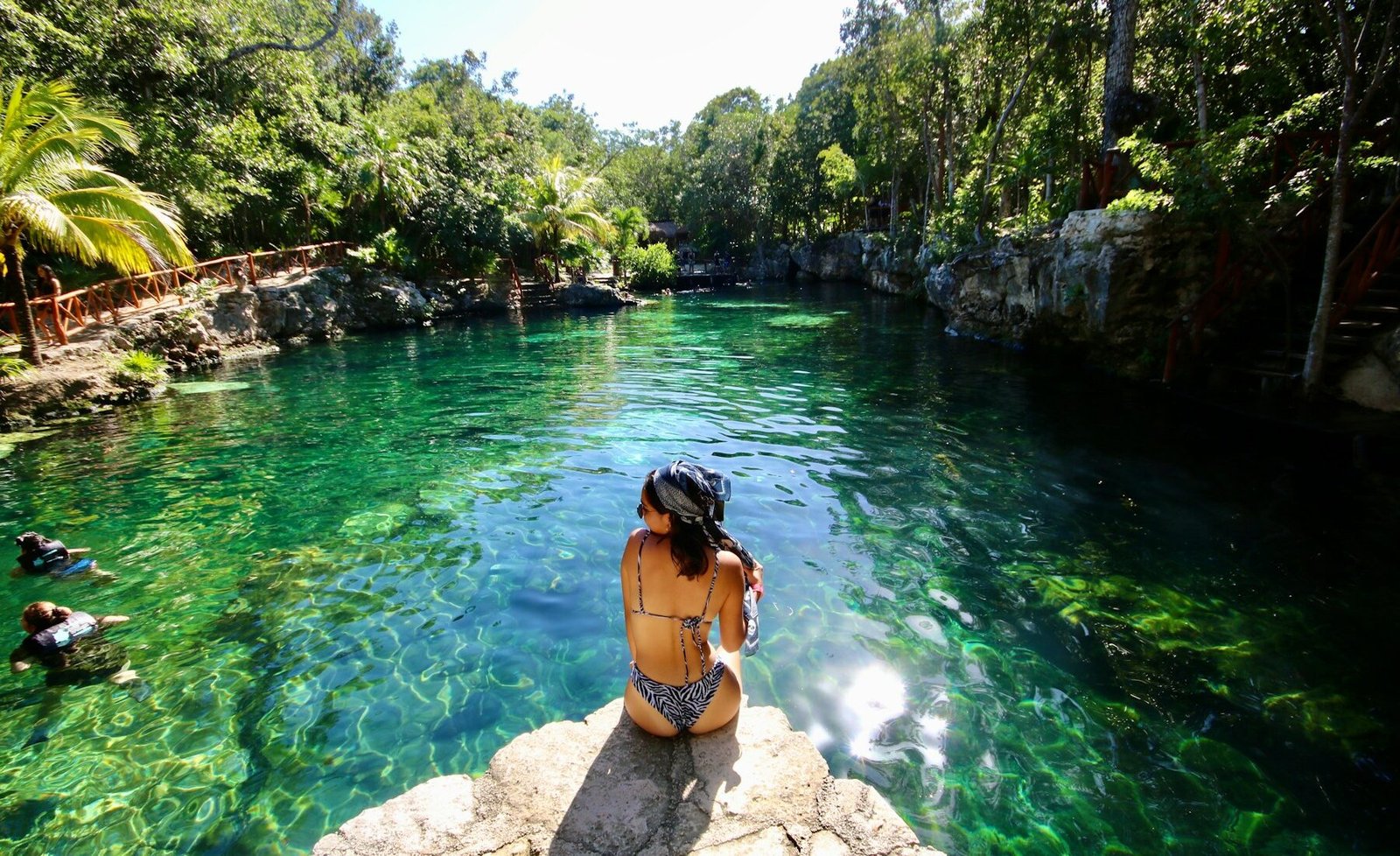 Clear turquoise water inside a cenote near Tulum